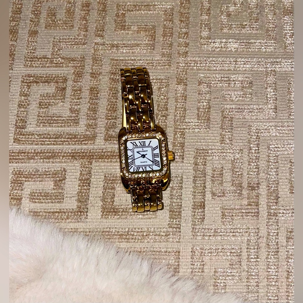 Peugeot watch gold tone, crystal bezel